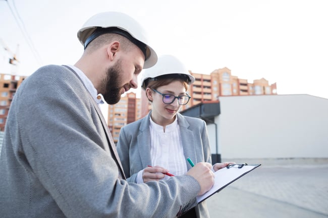 close-up-two-architect-working-together-construction-site