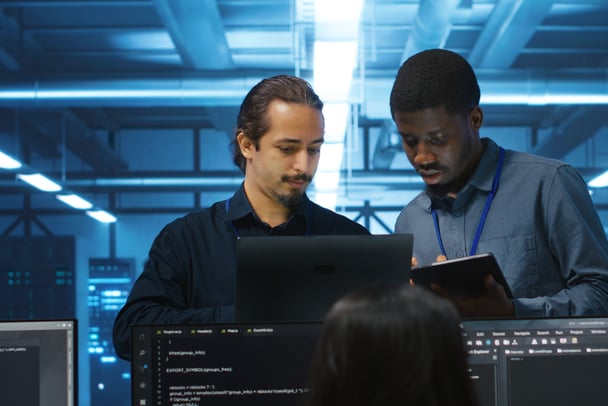 diverse-team-admins-supervising-data-center-supercomputers-1