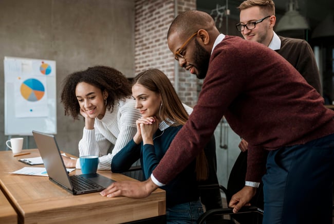 woman-showing-something-her-colleagues-meeting