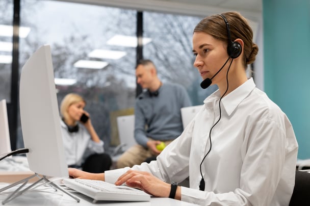 woman-working-call-center-talking-with-clients-using-headphones-microphone (1)